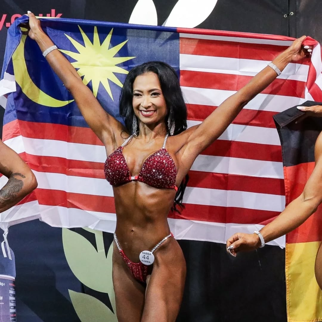 Dr. Aiesha Asmadi - Competition Victory with Malaysian Flag